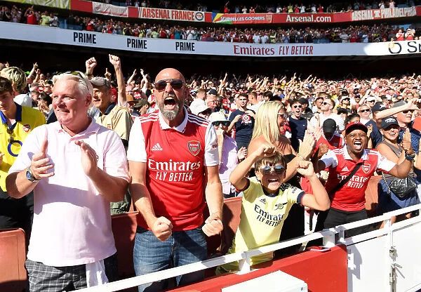 Arsenal Fans in Full Swing: Celebrating a Thrilling Victory over Leicester City (2022-23 Premier League)