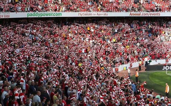 Arsenal Fans Unite: Scarves Raised in Victory (4:1 vs. Portsmouth, Barclays Premier League, Emirates Stadium, 2009)