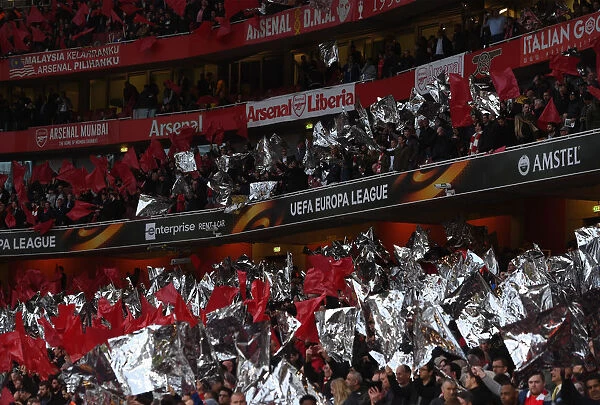 Arsenal Fans Unite: Waving Flags in Europa League Semi-Final Battle against Atletico Madrid