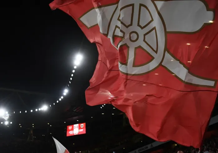 Framed Print : Arsenal Fans Wave Flags in Carabao Cup Match vs AFC Wimbledon