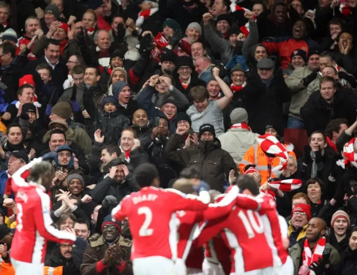 Framed Print : Arsenal Fans Go Wild: Celebrating the 3rd Goal in a 4-2 Victory over Bolton Wanderers (Barclays Premier League, Emirates Stadium, 20 / 1 / 10)