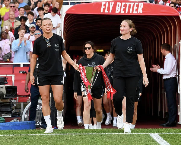 Arsenal FC Celebrate Conti Cup Victory: Katie McCabe and Kim Little with the Trophy (Arsenal vs. Wolverhampton Wanderers, 2022-23)