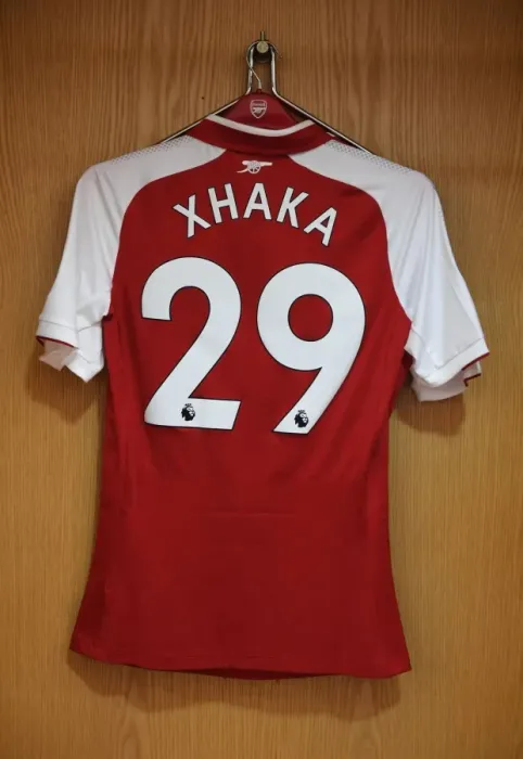 Framed Print : Arsenal FC: Granit Xhaka's Jersey in Arsenal Changing Room Before Arsenal vs Leicester City (2017-18)