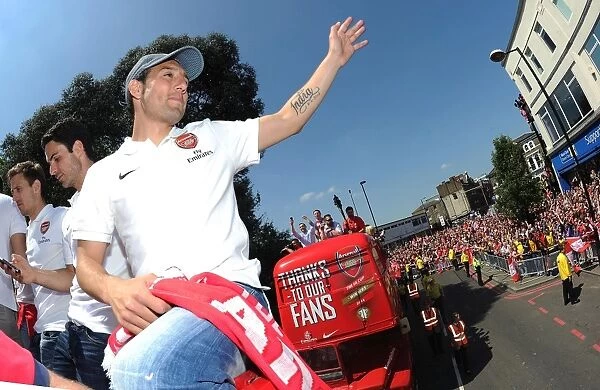 Arsenal FC: Santi Cazorla Celebrates FA Cup Victory during 2014 Parade in London