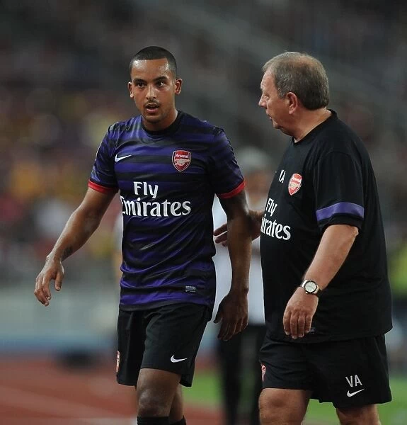 Arsenal FC: Theo Walcott and Vic Akers during Malaysia XI Friendly, 2012