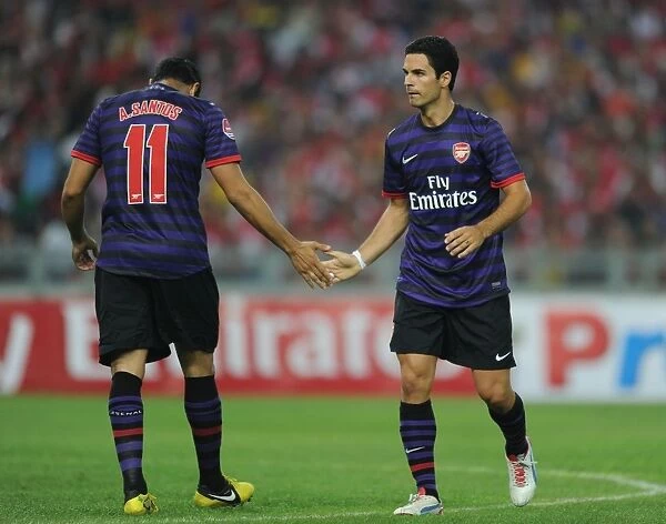 Arsenal FC Training in Malaysia: Mikel Arteta and Andre Santos in Action