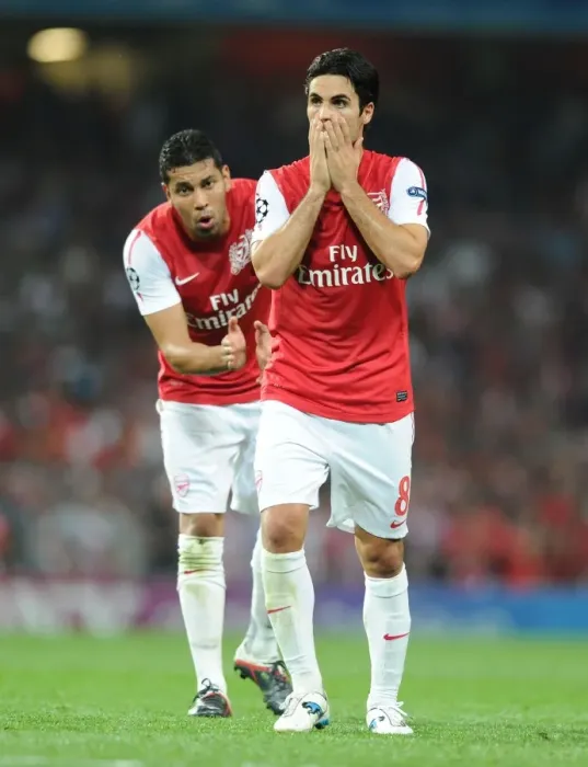 Framed Print : Arsenal FC vs Olympiacos FC: Mikel Arteta and Andre Santos in Action, UEFA Champions League 2011-12