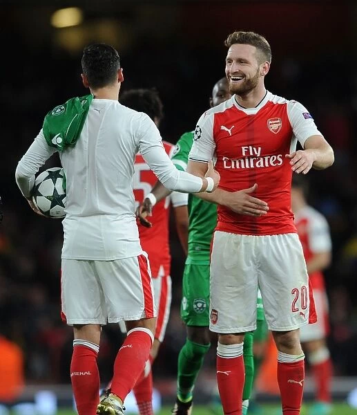 Arsenal FC vs PFC Ludogorets Razgrad: Mesut Ozil and Shkodran Mustafi Share a Moment after the UEFA Champions League Match
