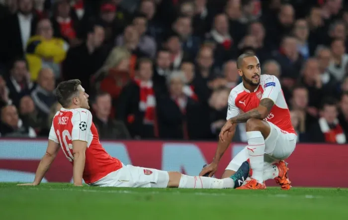 Framed Print : Arsenal FC: Walcott Comforts Injured Ramsey Amidst 2015 / 16 UEFA Champions League Battle Against FC Bayern Munchen