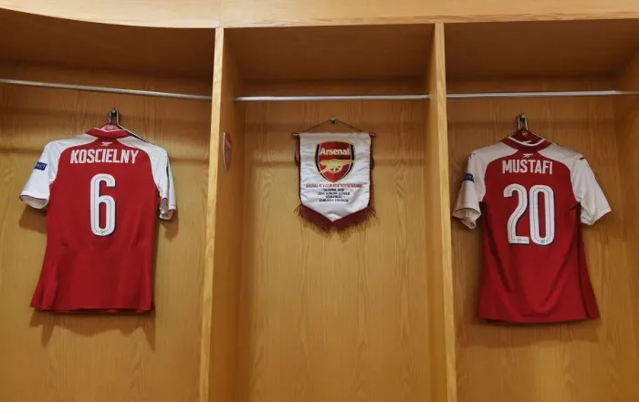 Framed Print : Arsenal FC's Empty Changing Room: Koscielny, Mustafi, Ozil, Lacazette, and Welbeck's Absence in UEFA Europa League Semi-Final vs Atletico Madrid