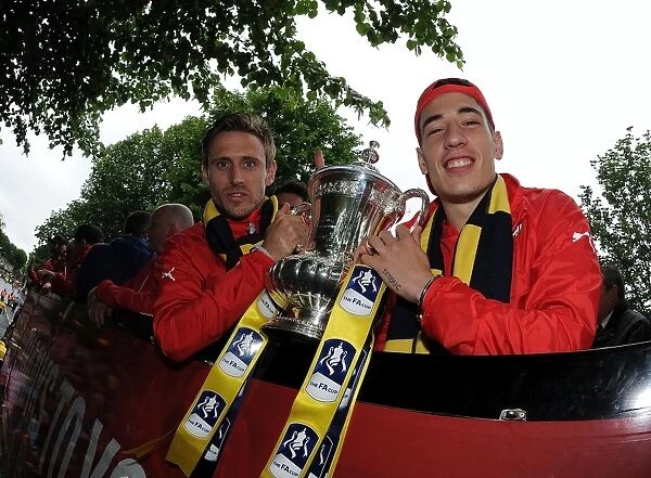 Arsenal Football Club: Monreal and Bellerin Celebrate FA Cup Victory during the 2014-15 Parade