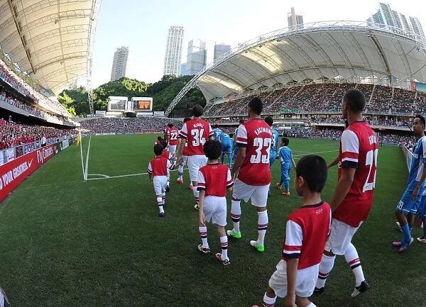 Arsenal Football Club: Pre-Season Friendly Match Against Kitchee FC in Hong Kong (2012) - Arsenal Team Walks onto the Pitch