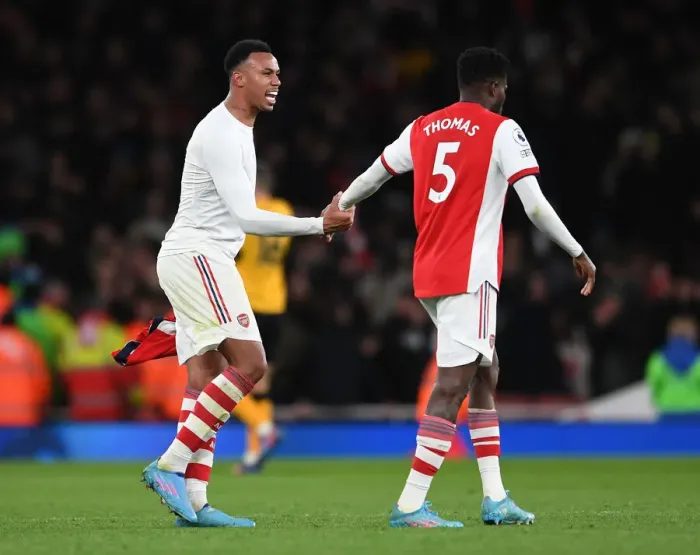 Framed Print : Arsenal: Gabriel Magalhaes and Thomas Partey Share a Moment after Arsenal vs. Wolverhampton Wanderers (2021-22) Framed Print : Arsenal: Gabriel Magalhaes and Thomas Partey Share a Moment after Arsenal vs. Wolverhampton Wanderers (2021-22)