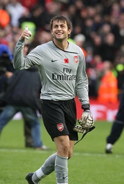 Arsenal goalkeeper Lucasz Fabianski celebrates the Arsenal victory