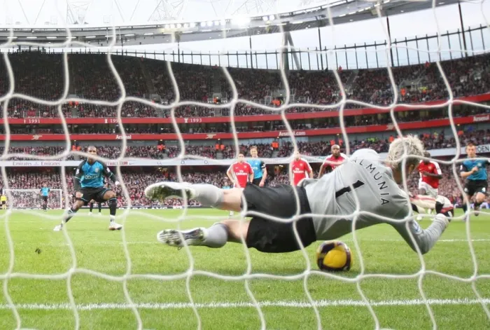Framed Print : Arsenal goalkeeper Manuel Almunia save a penalty from Ashley Young Framed Print : Arsenal goalkeeper Manuel Almunia save a penalty from Ashley Young