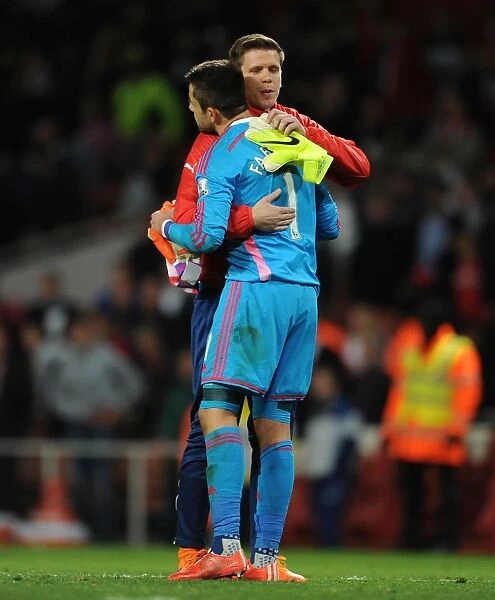 Arsenal Goalkeepers Szczesny and Fabianski Embrace Post-Match: A Moment of Sportsmanship between Rivals (Arsenal vs Swansea City, Premier League 2014 / 15)