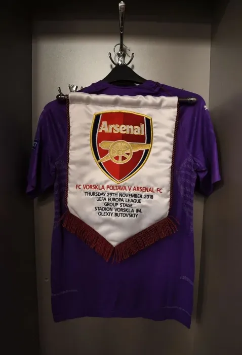 Framed Print : Arsenal Goalkeeping Gear: Pennant in Arsenal Changing Room for Vorskla Poltava Match Framed Print : Arsenal Goalkeeping Gear: Pennant in Arsenal Changing Room for Vorskla Poltava Match