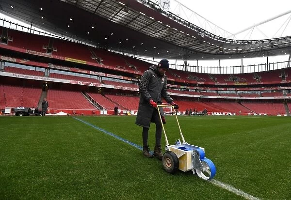 Arsenal Grounds Team Prepares Blue Turf for Arsenal vs Manchester City (2017-18)