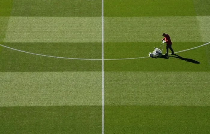 Framed Print : Arsenal Groundsman Meticulously Prepares Carabao Cup Pitch for Arsenal vs. Brentford