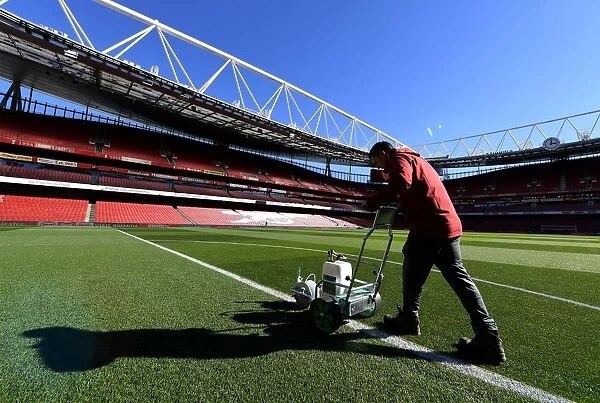 Arsenal Groundsman Meticulously Prepares Emirates Stadium Pitch for Carabao Cup Match