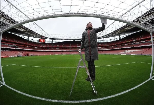 Arsenal Groundsman Prepares Emirates Stadium for Arsenal vs. Crystal Palace: Premier League Match