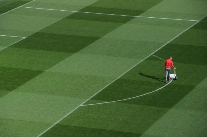 Framed Print : Arsenal Groundsman Prepares Emirates Turf for Arsenal vs. Bayern Munich Champions League Clash Framed Print : Arsenal Groundsman Prepares Emirates Turf for Arsenal vs. Bayern Munich Champions League Clash