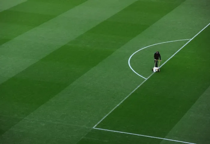Framed Print : Arsenal Groundsman Prepares Pitch for Arsenal vs Manchester United (2013-14)