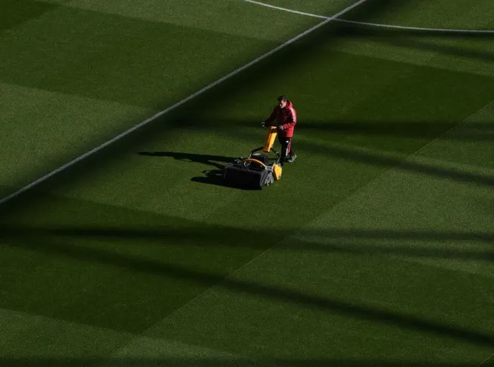 Framed Print : Arsenal: Groundsmen Prepare for Arsenal v Aston Villa at Emirates Stadium