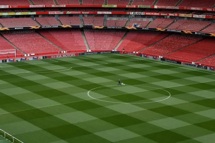 Framed Print : Arsenal: Groundsmen Prepare for Europa League Semi-Final Showdown vs Valencia Framed Print : Arsenal: Groundsmen Prepare for Europa League Semi-Final Showdown vs Valencia