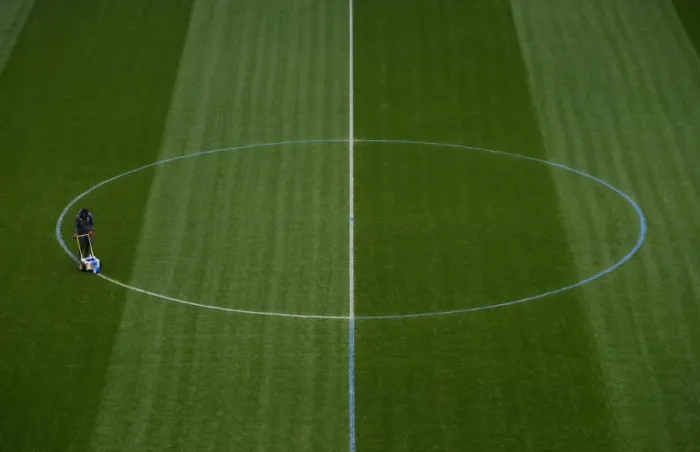 Framed Print : Arsenal Groundstaff Prepare Blue Turf for Arsenal vs Manchester City (2017-18)