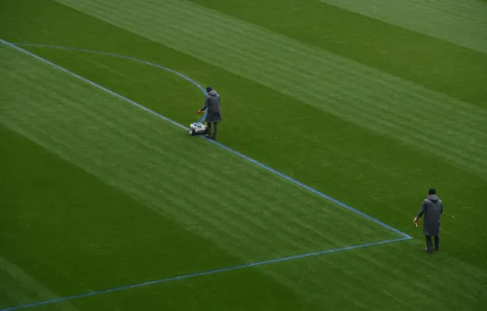 Framed Print : Arsenal Groundstaff Prepare Blue Turf for Premier League Clash against Manchester City Framed Print : Arsenal Groundstaff Prepare Blue Turf for Premier League Clash against Manchester City