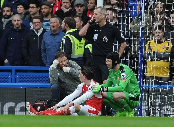 Arsenal: Hector Bellerin Receives Medical Assistance from Petr Cech and Colin Lewin during Chelsea Match