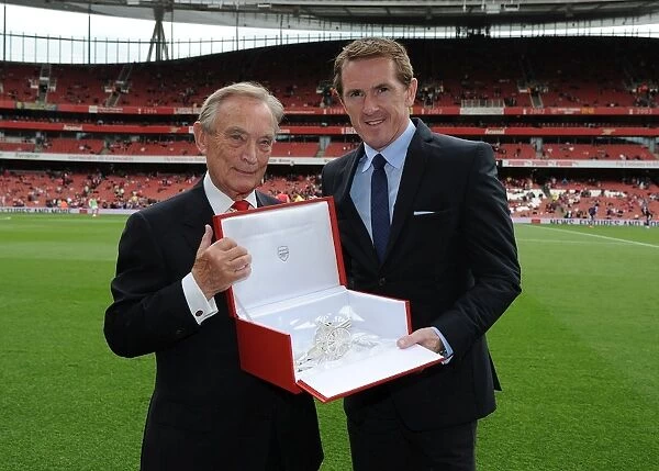 Arsenal Honors Retired Jockey AP McCoy with Silver Cannon at Arsenal vs. West Bromwich Albion Match