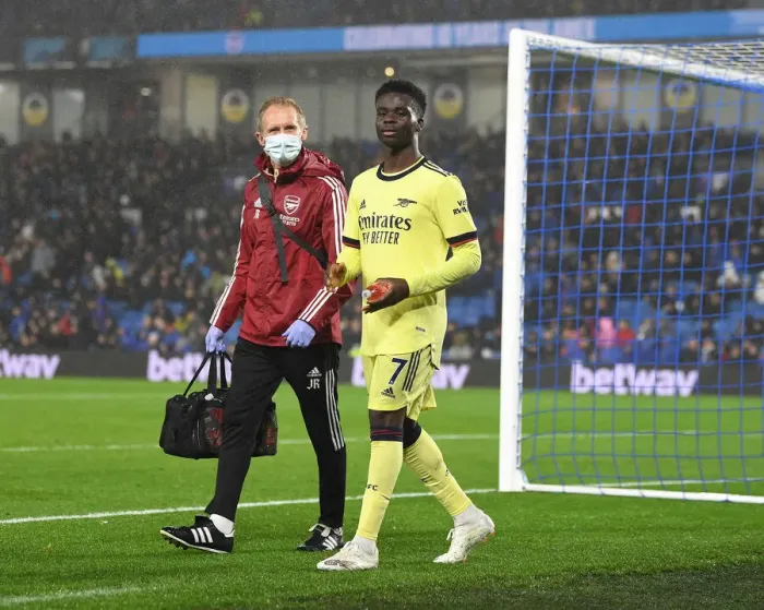 Framed Print : Arsenal: Jordan Reece Tends to Injured Bukayo Saka during Arsenal vs Brighton (2021-22) Framed Print : Arsenal: Jordan Reece Tends to Injured Bukayo Saka during Arsenal vs Brighton (2021-22)