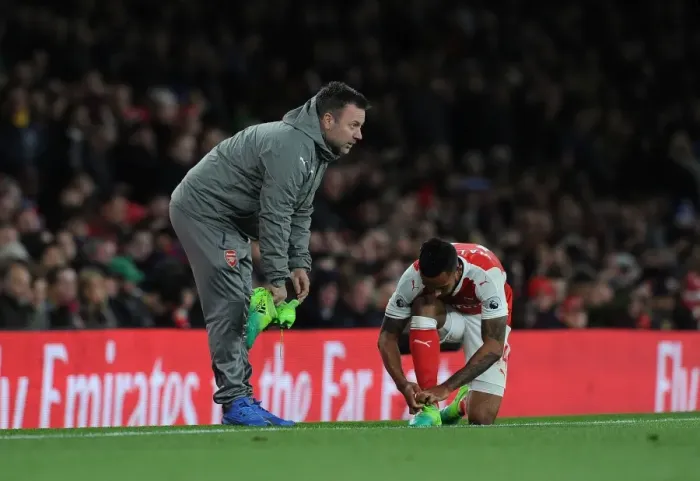 Framed Print : Arsenal: Kitman Paul Akers Prepares Theo Walcott for Arsenal v Leicester City (2016-17)