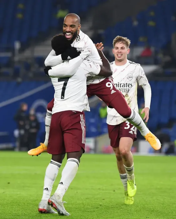 Framed Print : Arsenal: Lacazette and Saka's Jubilant Moment as They Celebrate Goal Against Brighton & Hove Albion, Premier League 2020-21