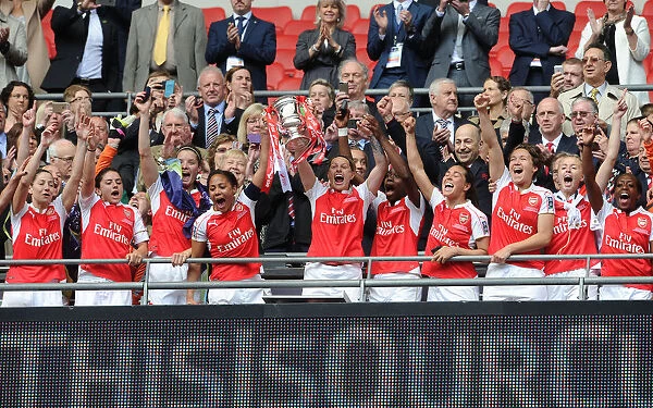 Arsenal Ladies Celebrate FA Cup Victory: Alex Scott and Kelly Smith Triumph with the Trophy