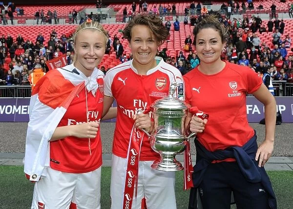Arsenal Ladies Celebrate FA Cup Victory: Williamson, Henning, and Taylor Lift the Trophy
