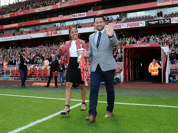 Arsenal Ladies Celebrate FA Cup Victory at Arsenal vs. Aston Villa (2015-16): Pedro Martinez Losa and Alex Scott with the FA Cup Trophy during Half Time