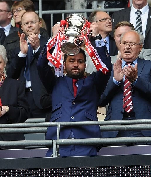 Arsenal Ladies FA Cup Victory: Pedro Martinez Losa Celebrates with the Trophy