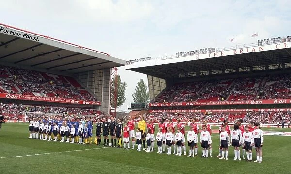 The Arsenal and Leeds teams line up before the match