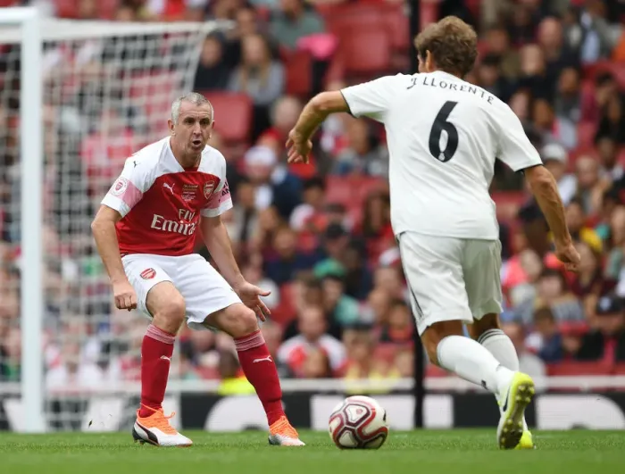 Framed Print : Arsenal Legends vs Real Madrid Legends: Nigel Winterburn vs Julio Llorente - A Football Showdown at Emirates Stadium