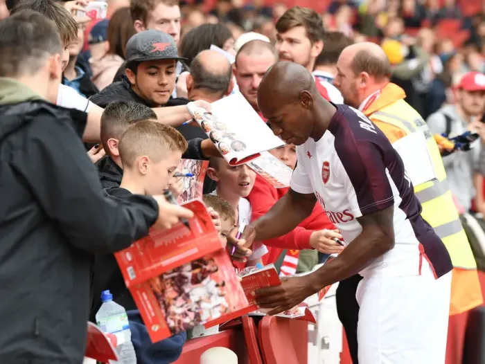 Framed Print : Arsenal Legends vs Real Madrid Legends: A Star-Studded Reunion at Emirates Stadium - Boa Morte and Fans Connect