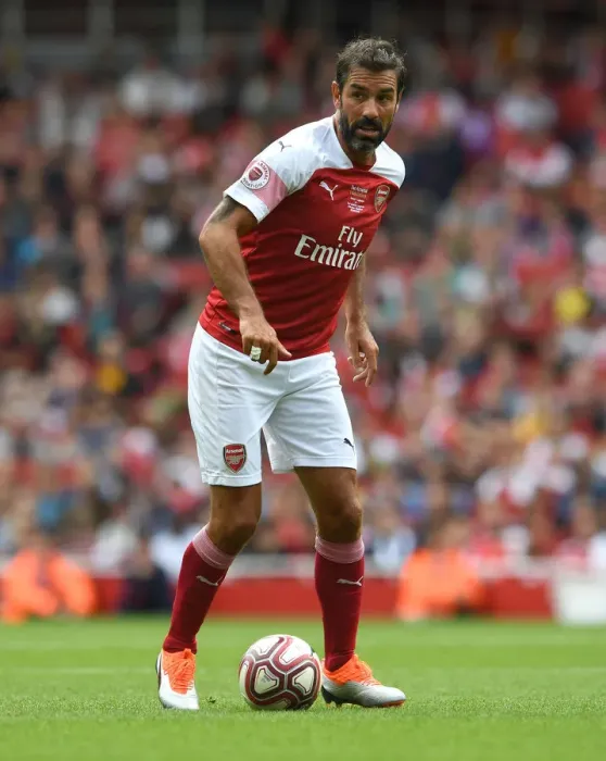 Framed Print : Arsenal Legends vs Real Madrid Legends: A Clash of Football Greats - Robert Pires in Action