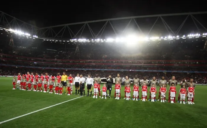Framed Print : The Arsenal and Liege teams line up with their mascots Framed Print : The Arsenal and Liege teams line up with their mascots