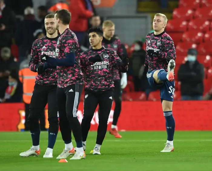 Framed Print : Arsenal and Liverpool Players Warm Up Ahead of Carabao Cup Semi-Final Clash