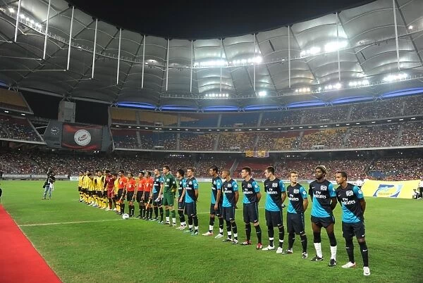 The Arsenal and Malaysia team line up before the match. Malaysia XI 0:4 Arsenal