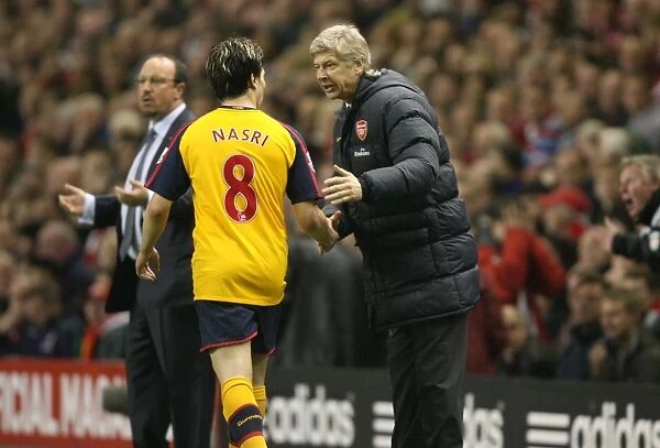 Arsenal manager Arsene talks with Samir Nasri