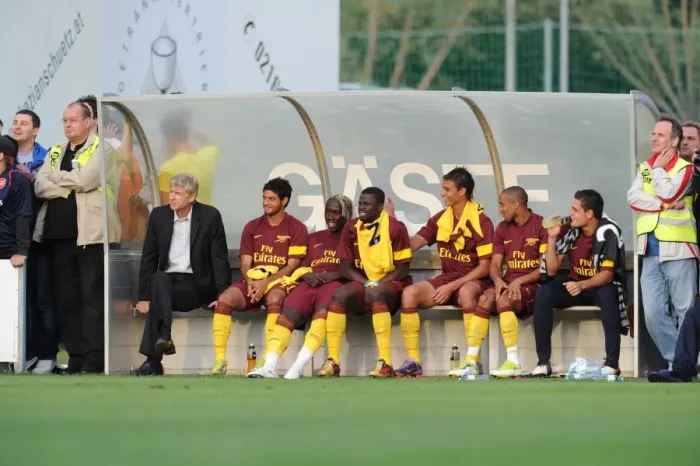 Framed Print : Arsenal manager Arsene Wenger on the bench with substitutes during the match Framed Print : Arsenal manager Arsene Wenger on the bench with substitutes during the match