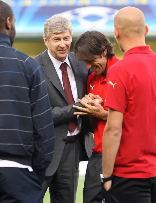 Framed Print : Arsenal manager Arsene Wenger with ex Arsenal player Robert PIres Framed Print : Arsenal manager Arsene Wenger with ex Arsenal player Robert PIres